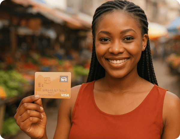 Woman holding Ilora MFB debit card